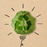 Light bulb drawing with recycling sign on crumpled recycled paper - Concept of ecology and recycling